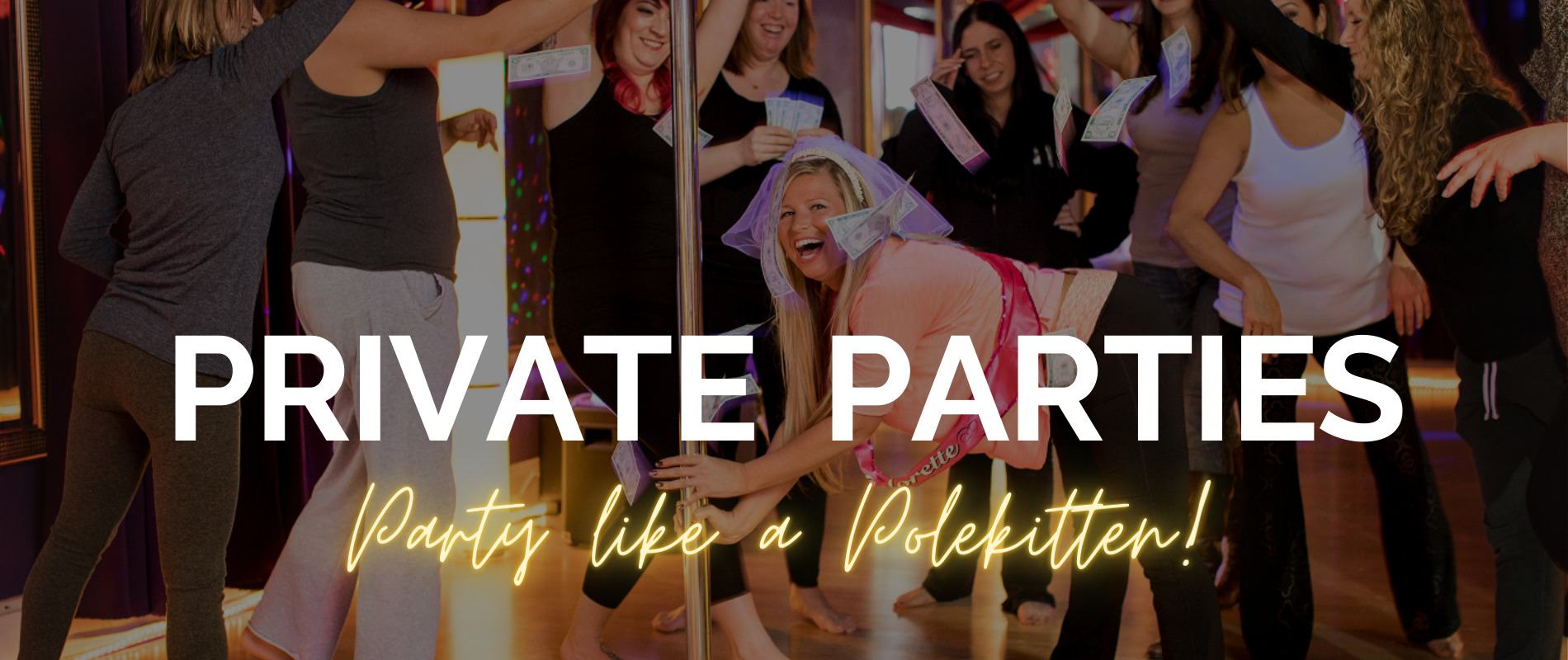 Group of women celebrating a bachelorette party with a pole dancing at Polekittens Studio, holding play money and smiling.